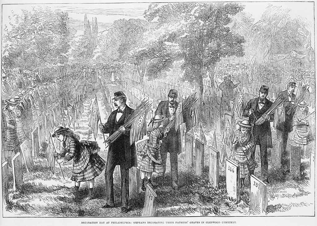 vintage picture of people putting flags next to headstones